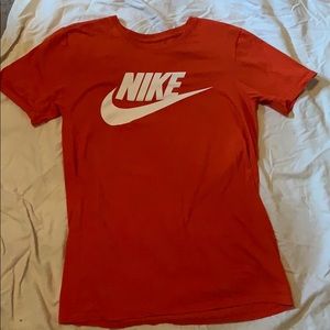 Orange Nike t shirt.